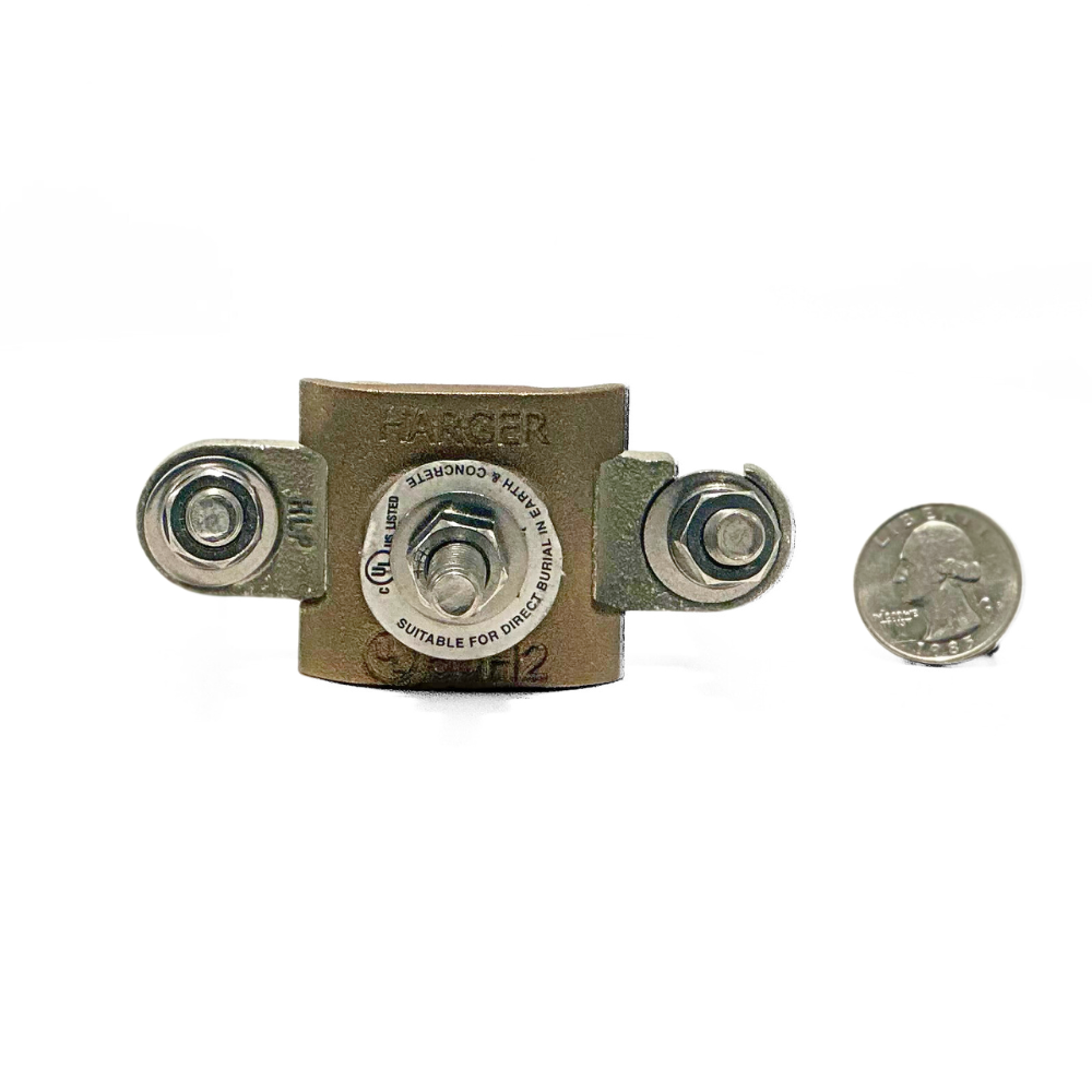 The Harger 1.5-2 Inch OD Pipe Clamp shown with a quarter for size reference, illustrating its compact yet robust design. Perfect for securing conductors in lightning protection and grounding systems, provided by American Rod Company. • Keywords: Harger 1.5-2 Inch OD Pipe Clamp, size reference, lightning protection, grounding systems, American Rod Company, UL Listed Lightning Protection, NFPA 780 Compliance, UL 96A Standards.