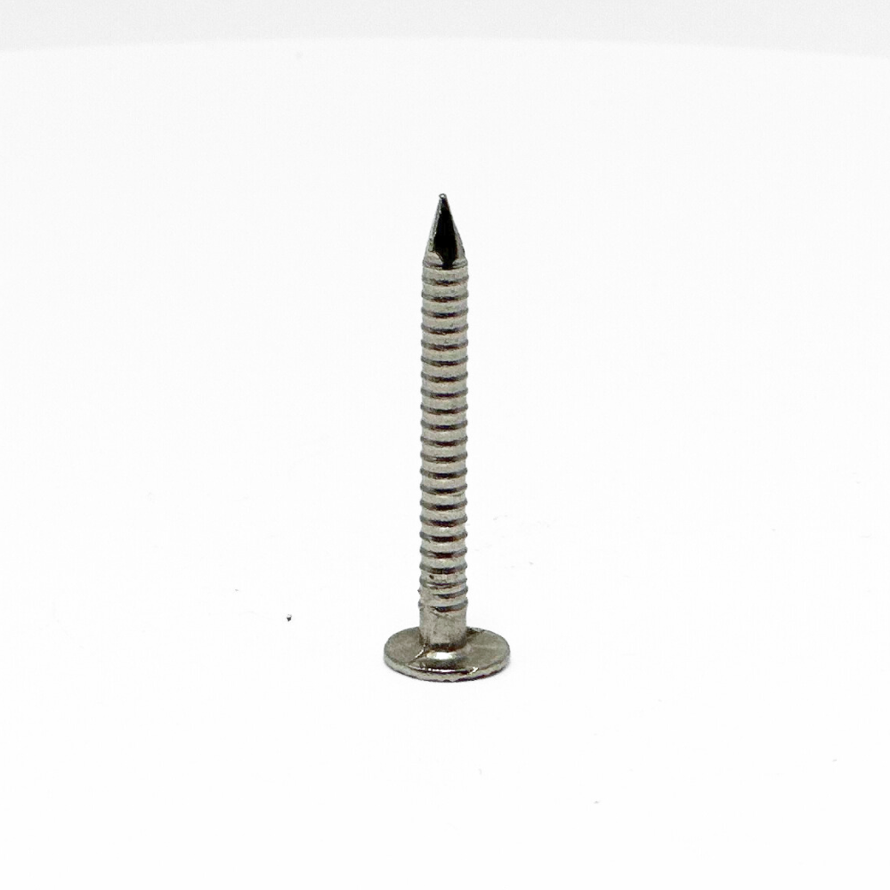 American Rod Company’s Large Headed Barbed Shank Nail, crafted from 304 stainless steel, positioned point up, showcasing its robust design. This 9 gauge, 1-1/2 inch nail is ideal for securing lightning protection components in residential installations, offering exceptional corrosion resistance and a precision barbed shank for enhanced holding power