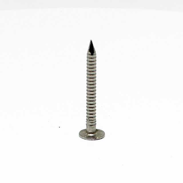 American Rod Company’s Large Headed Barbed Shank Nail, crafted from 304 stainless steel, positioned point up, showcasing its robust design. This 9 gauge, 1-1/2 inch nail is ideal for securing lightning protection components in residential installations, offering exceptional corrosion resistance and a precision barbed shank for enhanced holding power