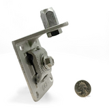 Cast Aluminum Offset Wall Point Base shown with a quarter for size reference. This base features a 2” offset point adapter and four mounting holes, ideal for lightning protection systems on masonry and metal surfaces. Ensures secure cable contact for main-sized cables, meeting UL Listed Lightning Protection standards. Provided by American Rod Company.