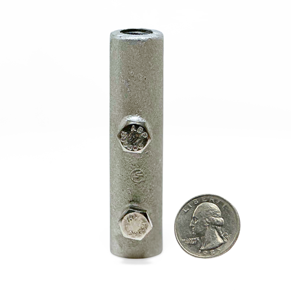 Vertical display of American Rod Company’s Cast Aluminum Straight Point Base/Splicer next to a quarter, illustrating the compact size and the functionality of the 3-inch length component in residential and commercial lightning protection scenarios